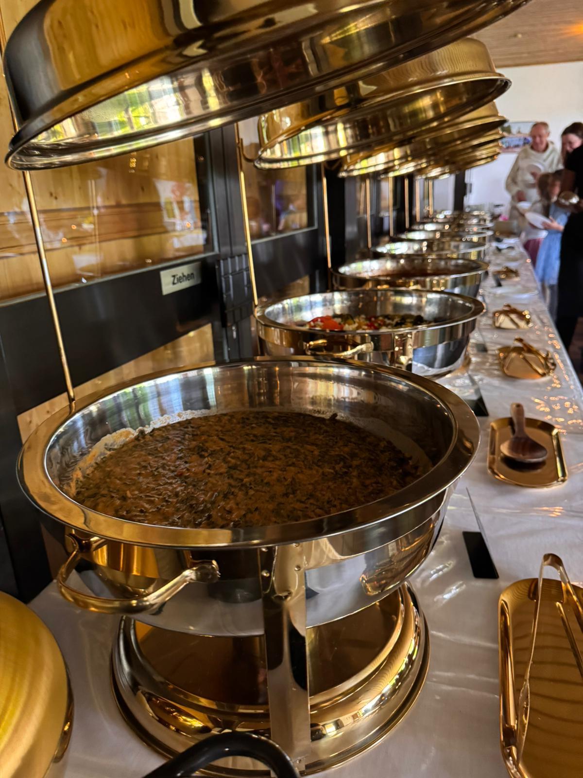 Gold buffet setup with plated food