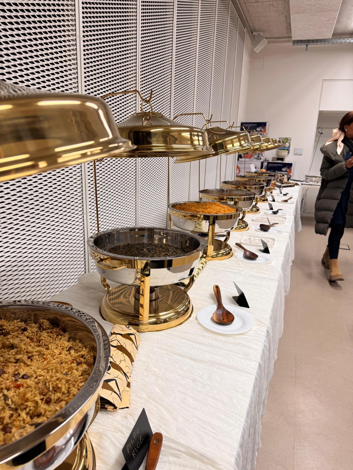 Buffet table with guests nearby